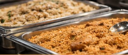 Trays of freshly cooked biriyani rice